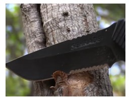 example of serrated edge blade pocket knife cutting wood shavings ideal for fire 