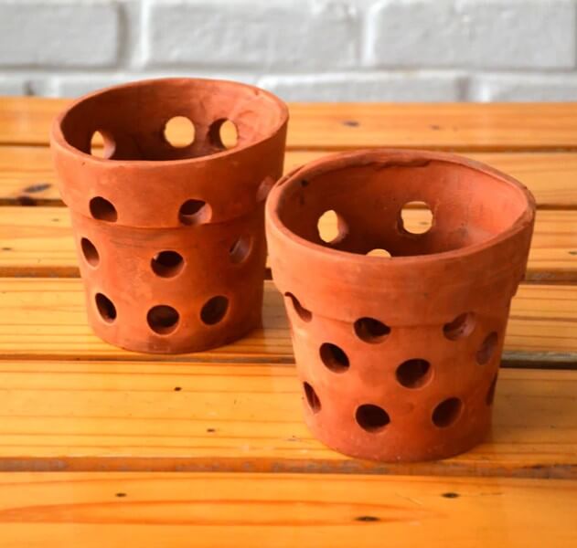Making drainage holes in pots with a knife